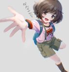 1girl akiyama_yukari backpack bag black_socks blackminolith_(2ne) blurry blurry_foreground brown_eyes brown_hair brown_shorts cargo_shorts casual clothes_writing commentary depth_of_field dog_tags girls_und_panzer grey_background highres looking_at_viewer messy_hair open_mouth pink_shirt pink_t-shirt reaching reaching_towards_viewer shirt short_hair short_sleeves shorts simple_background smile socks solo standing standing_on_one_leg suspender_shorts suspenders t-shirt