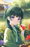  1girl blurry blurry_background commentary day depth_of_field flower freckles green_hair green_hanfu hand_up highres hitsukuya holding holding_flower kusuriya_no_hitorigoto long_hair long_sleeves looking_at_viewer maomao_(kusuriya_no_hitorigoto) outdoors red_flower solo violet_eyes 
