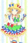  1girl blonde_hair blue_eyes blunt_bangs bow commentary_request cone_hair_bun cowboy_shot double_bun dress finger_to_cheek green_bow hair_bow hair_bun hands_up holding holding_microphone idol_clothes jewelry looking_at_viewer microphone minami_mirei multicolored_clothes multicolored_dress necklace pretty_series pripara red_bow short_hair smile solo sparkle_background standing striped_background striped_clothes striped_thighhighs thigh-highs unya_(unya-unya) 