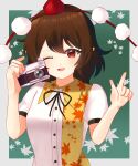  1girl :d black_ribbon breasts brown_hair camera chamusuke_(nesicoso_suke) hat highres holding holding_camera leaf_print one_eye_closed pointing pointy_ears pom_pom_(clothes) puffy_short_sleeves puffy_sleeves red_eyes red_hat ribbon shameimaru_aya shirt short_hair short_sleeves small_breasts smile solo tokin_hat touhou upper_body white_shirt 