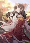  1girl ascot bare_shoulders bow brown_eyes brown_hair closed_mouth commentary_request detached_sleeves frilled_bow frilled_hair_tubes frills gohei hair_bow hair_tubes hakurei_reimu hand_on_own_hip happy highres long_hair long_sleeves red_bow red_skirt red_vest ribbon-trimmed_sleeves ribbon_trim skirt skirt_set smile solo touhou very_long_hair vest wanko_sora wide_sleeves yellow_ascot 