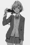  1girl blazer bob_cut bow bowtie camera canon_(company) cowboy_shot greyscale hand_up highres holding holding_camera jacket looking_at_viewer miniskirt monochrome open_mouth original pleated_skirt school_uniform shimkarom short_hair simple_background skirt smile solo sweater_vest 