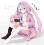  1boy animal_ears animal_hood asymmetrical_legwear black_socks cellphone closed_mouth collared_shirt commentary_request crossed_bangs cup disposable_cup fake_animal_ears frown full_body grey_hair hair_between_eyes highres holding holding_phone hood hood_up hoodie kasugano_(owf_ksg) long_bangs mahjong_soul male_focus mismatched_legwear multicolored_hair no_shoes phone pink_hair pink_hoodie purple_shorts rabbit_hood ryan_(mahjong_soul) shirt short_hair shorts sitting smartphone socks solo spill thigh-highs uneven_legwear violet_eyes white_shirt white_thighhighs 