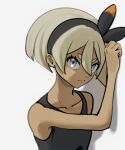 1girl bea_(pokemon) black_bodysuit black_hairband blonde_hair bodysuit bow_hairband closed_mouth collarbone commentary_request echizen_(n_fns17) eyelashes frown grey_eyes hair_between_eyes hairband hand_up juvenile pokemon pokemon_swsh short_hair solo teenage tomboy upper_body white_background young