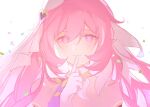  1girl annnnq bare_shoulders brooch confetti detached_sleeves elf elysia_(herrscher_of_human:ego)_(honkai_impact) elysia_(honkai_impact) finger_to_mouth gloves hair_between_eyes heart heart_brooch honkai_(series) honkai_impact_3rd jewelry long_hair looking_at_viewer pink_hair pink_pupils pointy_ears smile solo white_background white_gloves white_veil 