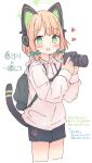  1girl absurdres animal_ear_headphones animal_ears backpack bag black_shorts blonde_hair blue_archive blush bow camera cat_tail cowboy_shot fake_animal_ears green_bow green_eyes green_halo hair_bow halo headphones heart highres holding holding_camera hood hood_down hoodie kamotsu_yasai long_sleeves looking_at_viewer midori_(blue_archive) open_mouth pink_hoodie short_hair shorts simple_background smile solo tail translation_request white_background 