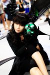  black_hair black_rock_shooter claws cosplay crossed_legs curly_hair dead_master glowing_eye green_eyes highres horns long_hair photo sakana scythe sitting skull solo 