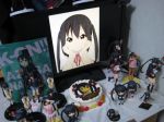  birthday black_hair cake figure food hand_on_cheek hands_on_own_cheeks hands_on_own_face happy_birthday k-on! lonely long_hair monitor nakano_azusa nendoroid photo school_uniform twintails 