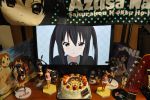  birthday black_hair cake figure food guitar highres instrument k-on! lonely long_hair monitor nakano_azusa nendoroid photo real school_uniform towel twintails 