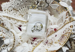  1girl acrylic_stand_(medium) blue_eyes chain chibi clock_hair_ornament commentary dress everlasting_(e.g.o) faust_(project_moon) gear_hair_ornament gold lace limbus_company long_sleeves looking_at_viewer nishikujic photo_(medium) plate project_moon short_hair solo symbol-only_commentary white_dress white_hair 