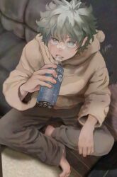  1boy absurdres barefoot boku_no_hero_academia bottle brown_hoodie commentary_request couch freckles green_eyes green_hair highres holding holding_bottle hood hood_down hoodie koromo06418109 long_sleeves male_focus midoriya_izuku parted_bangs parted_lips sanpaku short_hair sitting solo water_bottle wavy_hair 