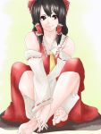  ascot bad_id barefoot black_hair bow brown_eyes detached_sleeves face feet hair_bow hakurei_reimu hands_clasped hands_on_feet long_hair miko smile solo somsom touhou v_arms 