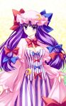  blush bow bows breasts cleavage crescent crescent_moon frown hair_ribbon hat large_breasts long_hair nail_polish patchouli_knowledge purple_eyes purple_hair ribbon sato-pon solo touhou 