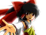 ascot bad_id black_hair bow bust detached_sleeves foreshortening hair_bow hakurei_reimu looking_at_viewer outstretched_hand ponytail red_eyes sarashi solo sora_no_amagumo touhou 
