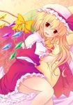 1girl blonde_hair blush flandre_scarlet hat hat_ribbon highres looking_at_viewer on_side open_mouth pillow pillow_hug puffy_sleeves red_eyes ribbon shirt short_sleeves side_ponytail skirt skirt_set solo touhou vest wing_ribbon wings yuzuki_sora 