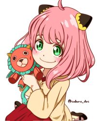  1girl ahoge anya_(spy_x_family) black_shoes blush child commentary director_chimera_(spy_x_family) eyebrows_hidden_by_hair green_eyes hairpods highres holding holding_stuffed_toy jacket medium_hair pink_hair red_skirt saburo_des shoes sitting skirt smile solo spy_x_family stuffed_toy symbol-only_commentary twitter_username wariza yellow_jacket 