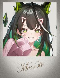  1girl :d ahoge arknights bare_shoulders black_hair bright_pupils cardigan character_name colored_inner_hair commentary_request crystal drawn_ears drawn_whiskers film_grain green_eyes grey_background grin hand_up huge_ahoge kampswe_galong long_hair looking_at_viewer mon3tr_(arknights) multicolored_hair off_shoulder photo_(object) pink_cardigan portrait simple_background single_sleeve_past_fingers smile solo white_pupils 