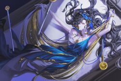  1girl armpits arms_up black_hair blue_dress blue_veil bracelet commentary_request dress evening_gown feet_out_of_frame from_above gold_cape hair_spread_out highres idarong insect_pin isolde_(reverse:1999) isolde_(the_last_fluttering_beat)_(reverse:1999) jewelry korean_commentary long_dress long_hair looking_at_viewer lying official_alternate_costume on_back picture_frame profile reverse:1999 sleeveless sleeveless_dress smile solo two-tone_dress veil very_long_hair violet_eyes white_dress 