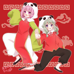  2girls animal_hood chinese_clothes commentary_request full_body green_hair highres hood kusanagi_nene ligh_xi long_hair long_sleeves lungs meandros multiple_girls ootori_emu open_mouth outstretched_arm panda_hood pants pink_eyes pink_hair project_sekai red_background short_hair signature sleeves_past_fingers sleeves_past_wrists smile standing standing_on_one_leg violet_eyes yi_er_fan_club_(vocaloid) 