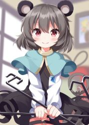  1girl animal_ears black_skirt black_vest blue_capelet blush capelet closed_mouth collared_shirt commentary cowboy_shot dowsing_rid grey_hair hair_between_eyes highres holding jewelry long_sleeves looking_at_viewer mouse_ears mouse_girl nazrin necklace red_eyes ruu_(tksymkw) shirt short_hair skirt skirt_set smile solo touhou vest white_shirt 