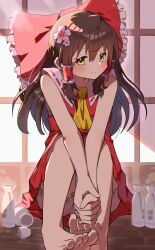  1girl absurdres ascot barefoot bloomers bow brown_hair cherry_blossoms choko_(cup) closed_mouth commentary cup flower frilled_bow frilled_hair_tubes frills hair_bow hair_flower hair_ornament hair_tubes hakurei_reimu highres interlocked_fingers kasuokasuto long_hair looking_at_viewer orange_eyes own_hands_together pink_flower red_bow red_skirt sitting skirt skirt_set smile solo toes tokkuri touhou white_bloomers yellow_ascot 