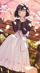  1girl absurdres apron bench black_hair black_shirt blurry blurry_foreground cherry_blossoms closed_eyes commentary_request falling_petals food_request full_body guest_art hand_to_own_mouth highres holding holding_skewer maid-san_wa_taberu_dake maid_apron maid_headdress ningen_gokko petals shirt short_hair sitting skewer solo suzume_(maid-san_wa_taberu_dake) wooden_bench 