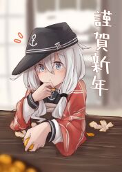  1girl alternate_hairstyle anchor_symbol blue_eyes blush closed_mouth commentary_request eating flat_cap food fruit hair_between_eyes hat hibiki_(kancolle) highres kantai_collection kuuru_(kuuru-n) long_hair long_sleeves mandarin_orange sailor_collar school_uniform serafuku solo twintails white_hair 