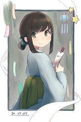  1girl alternate_costume black_hair blush commentary dated fubuki_(kancolle) green_eyes grey_skirt highres holding holding_paper holding_tanzaku japanese_clothes kantai_collection kimono lantern long_sleeves looking_at_viewer looking_back ma_rukan obi outside_border paper paper_lantern ponytail raised_eyebrows sash short_hair short_ponytail sidelocks signature skirt smile solo star_(symbol) swept_bangs tanabata tanzaku wide_sleeves yukata 