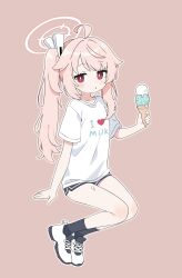 1girl absurdres black_shorts black_socks blue_archive commentary english_commentary food full_body hair_ornament halo highres ice_cream long_hair looking_at_viewer natsu_(blue_archive) pink_background pink_hair red_eyes shirt short_shorts short_sleeves shorts simple_background socks solo torimew white_shirt 
