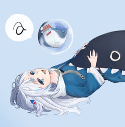  1girl a_(phrase) blue_background blue_eyes blue_hair blue_hoodie blue_nails blush collarbone commentary gawr_gura grey_hair hair_ornament hololive hololive_english hood hood_down hoodie long_hair long_sleeves looking_at_viewer lying multicolored_hair nail_polish on_back open_mouth sharp_teeth sidelocks solo speech_bubble streaked_hair teeth ugaaaa1 upper_body virtual_youtuber 