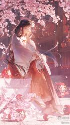  1girl absurdres black_hair blunt_bangs cherry_blossoms closed_mouth daruma_doll day falling_petals fox_mask full_body hakama hakama_skirt hand_on_own_cheek hand_on_own_face highres holding holding_mask inuyasha japanese_clothes kikyou_(inuyasha) kimono long_hair long_sleeves mask outdoors petals red_hakama ribbon-trimmed_sleeves ribbon_trim sandals sitting skirt smile socks solo tabi very_long_hair violet_eyes wanou white_kimono white_socks wide_sleeves zouri 