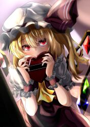  1girl blonde_hair box commentary cowboy_shot dutch_angle fang flandre_scarlet hair_between_eyes hair_ribbon hat heart-shaped_box holding holding_box long_hair looking_at_viewer mob_cap open_mouth pandoa_(mikage0495) puffy_short_sleeves puffy_sleeves red_eyes red_ribbon ribbon shirt short_sleeves solo touhou white_hat white_shirt wings wrist_cuffs yellow_shirt 