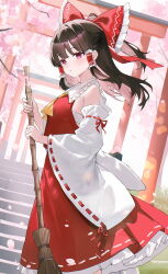  1girl absurdres ascot bamboo_broom bow broom brown_hair cherry_blossoms chest_sarashi commentary detached_sleeves frilled_bow frilled_hair_tubes frilled_skirt frills from_side hair_bow hair_tubes hakurei_reimu highres holding holding_broom long_hair outdoors red_bow red_eyes red_skirt ribbon-trimmed_shirt ribbon-trimmed_sleeves ribbon_trim sarashi shirt skirt skirt_set solo stairs torii touhou usagi_(786113654) yellow_ascot 