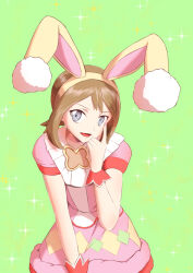  1girl animal_ears brown_hair commentary_request commission dress fake_animal_ears finger_to_face green_background grey_eyes looking_at_viewer may_(pokemon) may_(spring_2021)_(pokemon) nakanokouga official_alternate_costume open_mouth pink_dress pink_nails pokemon pokemon_masters_ex rabbit_ears solo sparkle wrist_cuffs 
