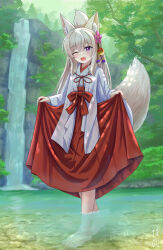  1girl :d ;d absurdres animal_ear_fluff animal_ears barefoot bow brown_hair commentary_request day fang flower folded_ponytail fox_ears fox_girl fox_tail hair_between_eyes hair_flower hair_ornament hakama hakama_skirt highres iroha_(iroha_matsurika) japanese_clothes kimono koyoi_(iroha_(iroha_matsurika)) long_hair long_sleeves miko one_eye_closed original outdoors pink_flower red_bow red_hakama shallow_water skirt smile solo tail tree very_long_hair violet_eyes wading walking water waterfall white_kimono wide_sleeves 