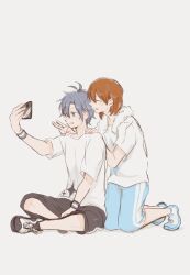 antenna_hair black_hair black_shorts blue_shoes blue_shorts brown_hair closed_eyes crossed_legs grey_eyes hagiwara_yukiho hands_on_another's_shoulders highres holding holding_phone idolmaster idolmaster_(classic) kikuchi_makoto mura_mura50 parted_bangs phone selfie shirt shoes shorts sidelocks sitting smile sneakers sweatband towel towel_around_neck v white_shirt white_trim 