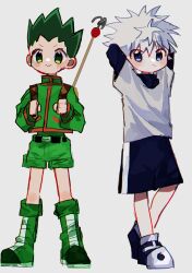  2boys :> arms_behind_head belt black_belt black_shoes black_shorts blue_eyes blush boots closed_mouth commentary_request full_body gon_freecss green_boots green_eyes green_hair green_shirt green_shorts highres hunter_x_hunter killua_zoldyck layered_sleeves long_sleeves male_focus meda_cha multiple_boys shirt shoes short_hair short_over_long_sleeves short_sleeves shorts simple_background smile spiky_hair standing white_background white_hair white_shirt 