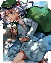  1girl absurdres arm_pouch artist_name backpack bag blue_boots blue_dress blue_eyes blue_hair boots border chirooo92084 commentary dappled_sunlight day dot_nose dress feet_out_of_frame flat_cap green_bag green_hat hair_bobbles hair_ornament hat highres holding holding_wrench jewelry kawashiro_nitori key key_necklace knee_up long_sleeves looking_to_the_side necklace outdoors outside_border pocket pouch rubber_boots smile solo split_mouth sunlight touhou twintails twitter_username two_side_up white_border wrench 