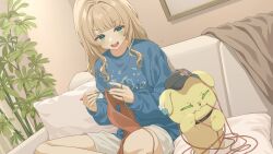  1girl :d blonde_hair blue_shirt blush couch green_eyes hair_down highres indian_style kaburaki_roco knitting knitting_needle needle nijisanji on_couch shirt shorts sitting smile sonoat_753 virtual_youtuber 