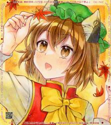  1girl adversarial_noise alto2019 animal_ear_fluff animal_ear_piercing animal_ears autumn_leaves blush bow bowtie brown_eyes brown_hair cat_ears chen commentary_request earrings falling_leaves fang green_hat hat holding holding_leaf hoop_earrings jewelry leaf long_sleeves maple_leaf marker_(medium) mob_cap open_mouth red_vest shirt short_hair single_earring solo touhou traditional_media upper_body vest white_shirt yellow_bow yellow_bowtie 
