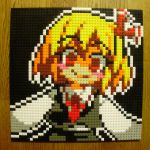  1girl blonde_hair blush_stickers crazy_eyes highres lego photo red_eyes rumia shaded_face short_hair smile solo touhou you_rei_(blowback) 