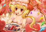  bad_id blonde_hair flandre_scarlet food fruit grapes hat heart holding holding_fruit holding_strawberry lying mozuyun on_stomach red_eyes solo strap_slip strawberry the_embodiment_of_scarlet_devil touhou 