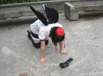  1girl camera cosplay hat orz photo real_person shameimaru_aya solo thighhighs tokin_hat touhou wings 