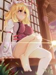  bare_legs barefoot blonde_hair breasts feet grass hat highres impossible_clothes impossible_clothing large_breasts lens_flare long_hair nanase_nanami outdoors red_eyes sitting solo sun touhou yakumo_yukari 