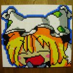  1girl :d blonde_hair blush_stickers closed_eyes derivative_work fox_tail hat highres lego multiple_tails open_mouth photo pixel_art smile solo table tail touhou yakumo_ran you_rei_(blowback) 