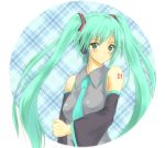  arm_grab arm_holding bare_shoulders blush circle detached_sleeves face green_eyes green_hair hatsune_miku holding_arm konimaru long_hair looking_at_viewer necktie plaid plaid_background smile solo tattoo twintails vocaloid 