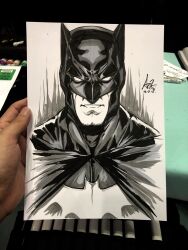  1boy art_tools_in_frame artist's_hand_in_frame bat_mask batman batman_(series) batman_symbol black_mask commentary cowl cropped_torso dc_comics english_commentary facing_viewer highres male_focus marker_(medium) mask monochrome parted_lips photo_(medium) signature sketch solo stanley_lau traditional_media 