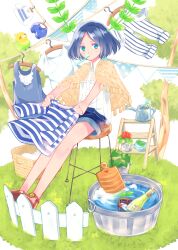  1girl basket black_hair blue_eyes blue_hair blue_shorts bob_cut bottle capelet clothes_pin clothesline commentary cup denim fence flower grass holding laundry looking_at_viewer mouth_hold original outdoors plant potted_plant rubber_duck sandals shirt shoes short_hair short_shorts shorts sitting solo stool string_of_flags towel tree tsutomu_(hghrttm) water watering_can white_shirt wooden_fence 