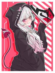  1girl absurdres air_jordan black_hoodie blush border demon_horns demon_tail earrings from_side green_eyes grin hand_in_pocket heterochromia highres holding_single_shoe hood hoodie horns ishigami_nozomi ishigami_nozomi_(2nd_costume) jewelry looking_at_viewer low_twintails lozi multicolored_hair nijisanji nike_(company) pink_hair red_eyes red_nails shoes smile sneakers solo streaked_hair tail twintails virtual_youtuber white_border white_hair 