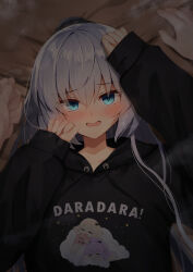  1boy 1girl absurdres akatsuki_yureru_koi_akari black_hoodie black_scrunchie blush casual character_print clothes_writing commentary eyelashes eyes_visible_through_hair furrowed_brow green_eyes grey_hair hair_between_eyes hair_ornament hair_scrunchie hair_spread_out hands_up hetero highres hood hood_down hoodie long_hair looking_at_viewer lying nodoameyatou on_back on_bed open_mouth ponytail pov pov_hands print_hoodie scrunchie sleeves_past_wrists solo_focus suzakuin_momiji tsurime upper_body very_long_hair 